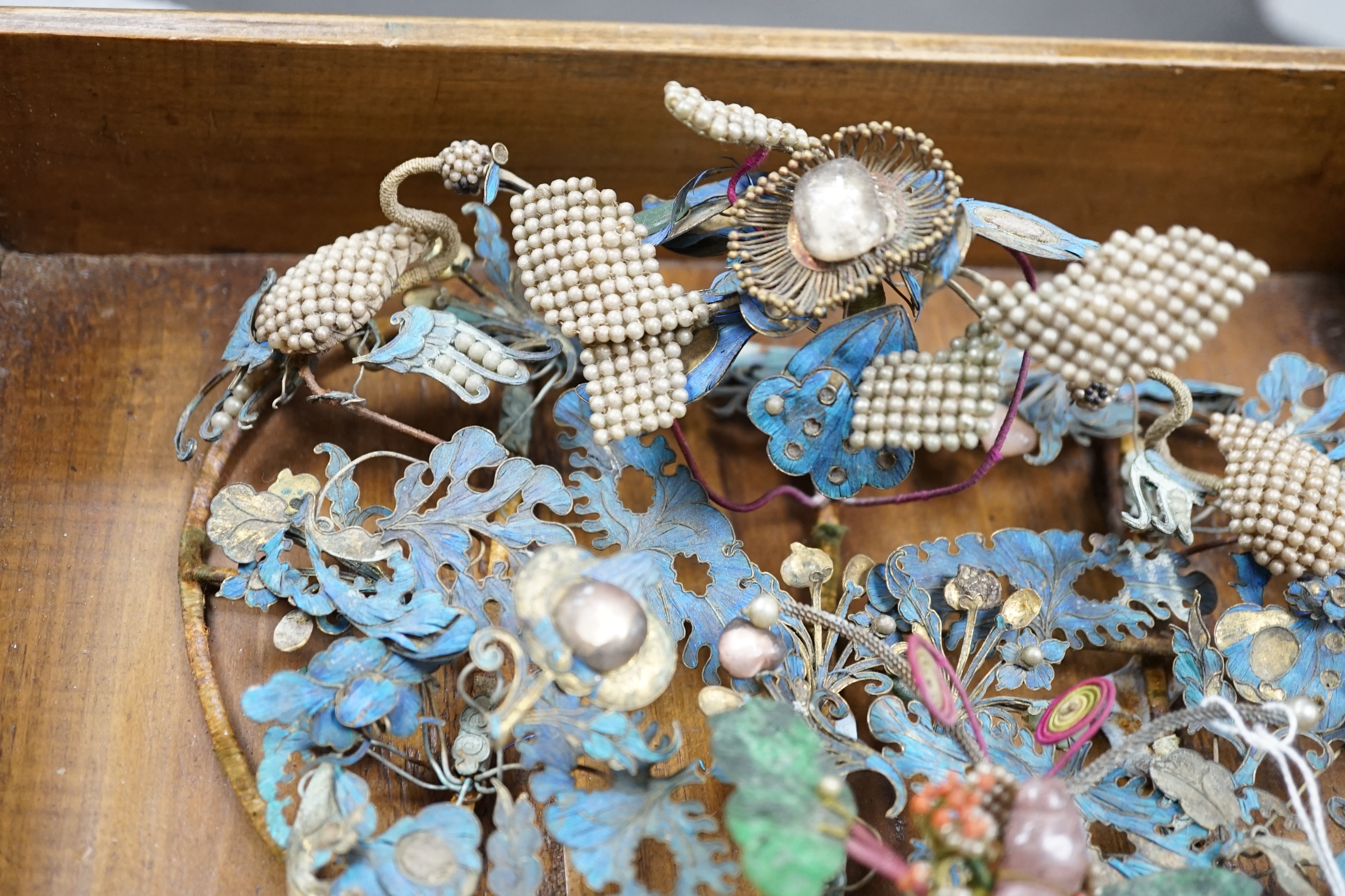 A group of eight Chinese kingfisher feather, jade, seed pearl, coral and hardstone mounted headdresses and ornaments, late Qing dynasty, some losses